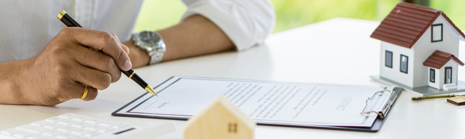 Man With Clipboard Filling Out Paperwork